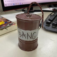 a brown can with the word bang on it sits on a desk